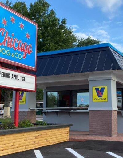 Fast food restaurant with a sign announcing "opening april 1st.