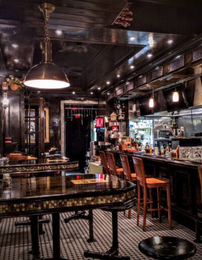 Vintage-style diner interior with bar seating and classic checkered flooring.