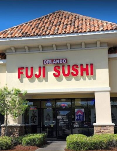 Exterior view of orlando fuji sushi restaurant under a clear sky.